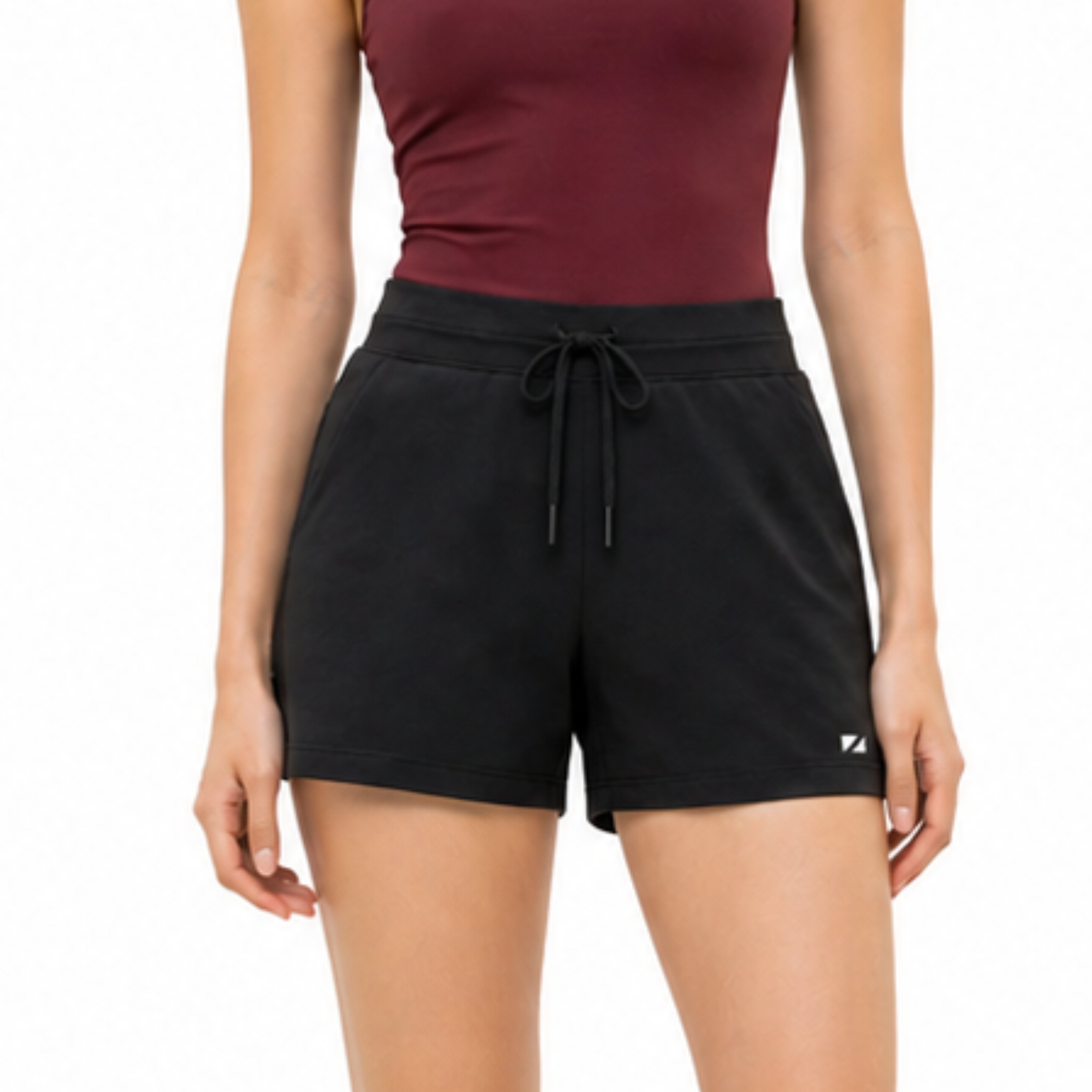 Person wearing black shorts and a maroon top on a white background